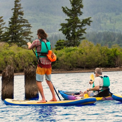 people in the water on kayak and SUP board