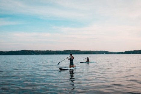 a man in a boat on a body of water