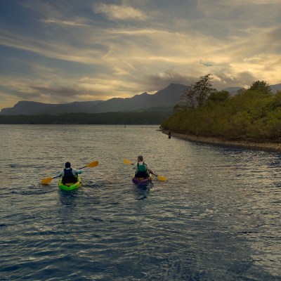 a group of people on kayaks in the water
