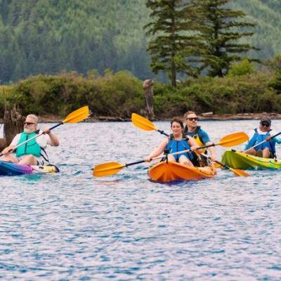 a group of people kayaking in the water