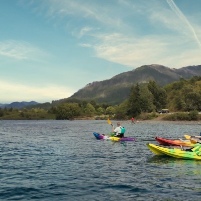 a group of people in a small boat in the Columbia River