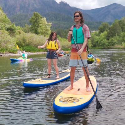 a tall person on a sup on the Columbia River in Cascade Locks