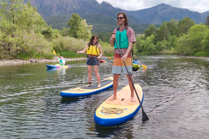 a tall person on a sup on the Columbia River in Cascade Locks